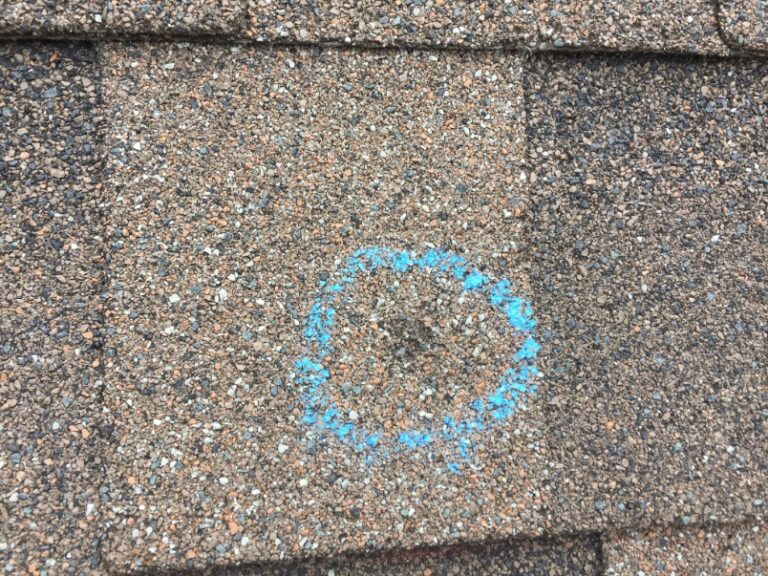 Hail mark on asphalt shingle