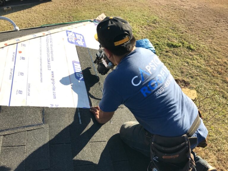 Capstone Roofing crew installing asphalt shingles on a Birmingham-area home.