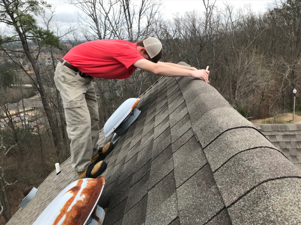 Insurance adjuster inspecting a roof