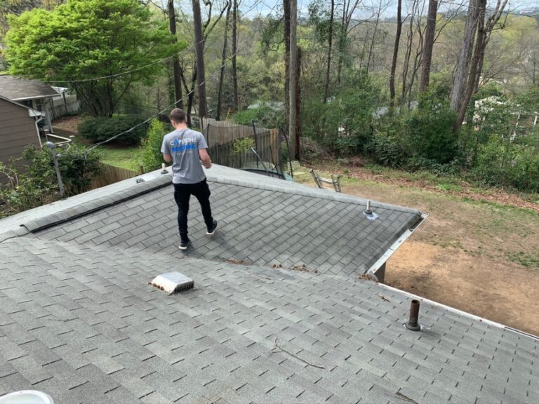 Roofer inspecting a roof
