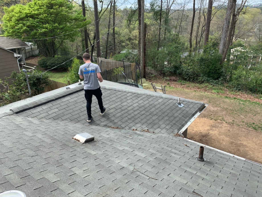 Roofer completing a roof inspection