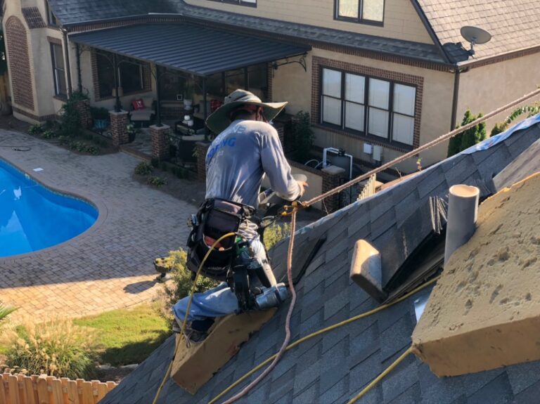 Capstone Roofing worker on the roof.