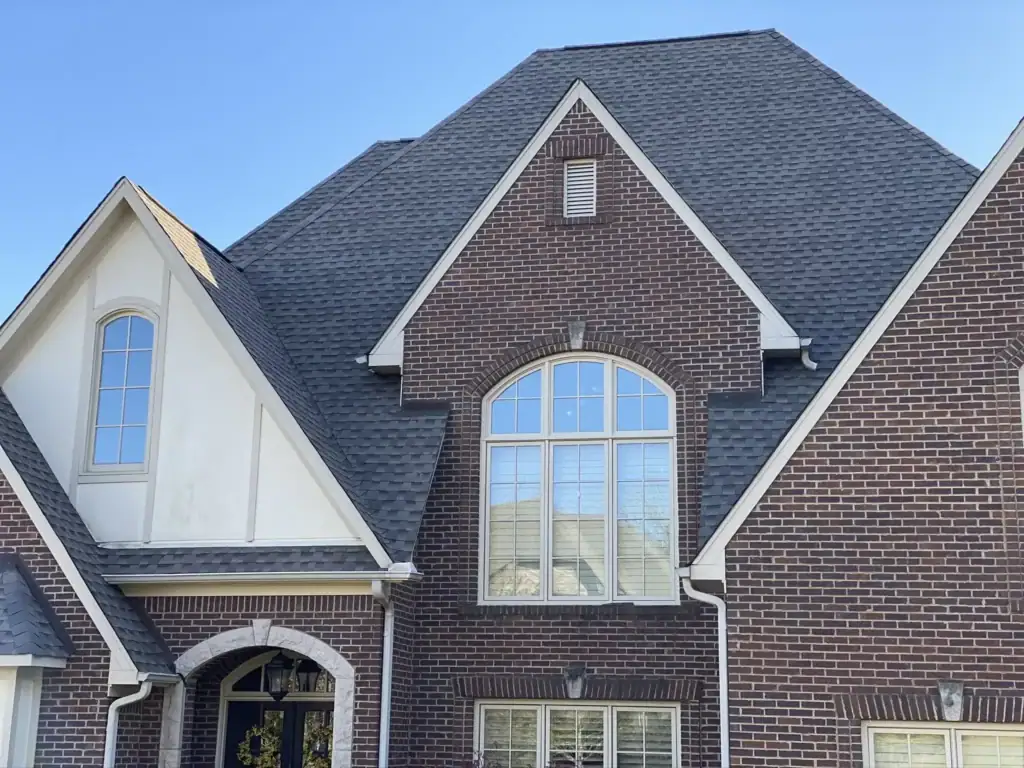 Close-up of dark charcoal architectural shingles installed by Capstone Roofing